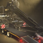 Zaprojektowane z myślą o elastycznym transporcie na place budowy i z nich wyjątkowo długie i szerokie wgłębienie na wysięgnik koparki w naczepach Goldhofer STEPSTAR nie ma poprzeczek i jest otwarte z tyłu, co umożliwia przewożenie koparek o długich ramionach przy jednoczesnym zmniejszeniu całkowitej wysokości. Naczepa jest również wyposażona w lekkie i długie rampy, z prostą regulacją w celu zwiększenia szerokości do 2990 mm lub całkowitego zsunięcia ramp (fot. Goldhofer)